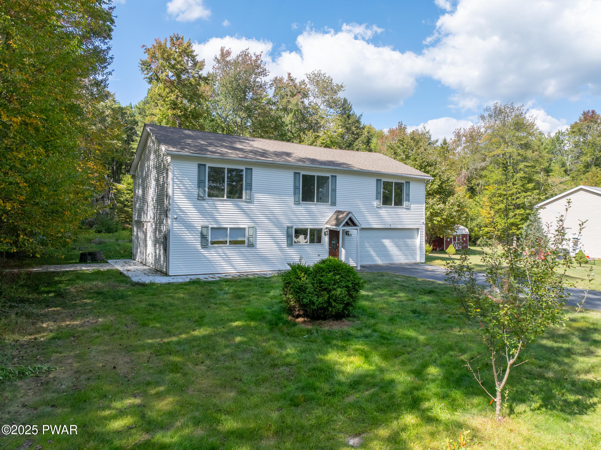 153 Hatton Road Hawley, PA 18428 - Photo 33 of 38 a view of a house with yard and a garden