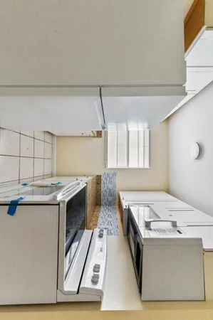 a kitchen with a stove and a microwave