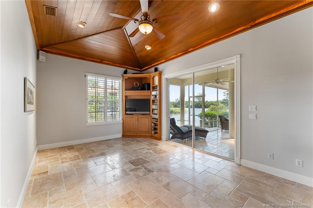 103 Aqua Ra Drive Jensen Beach, FL 34957 - Photo 16 of 48 a view of livingroom with a ceiling fan and window