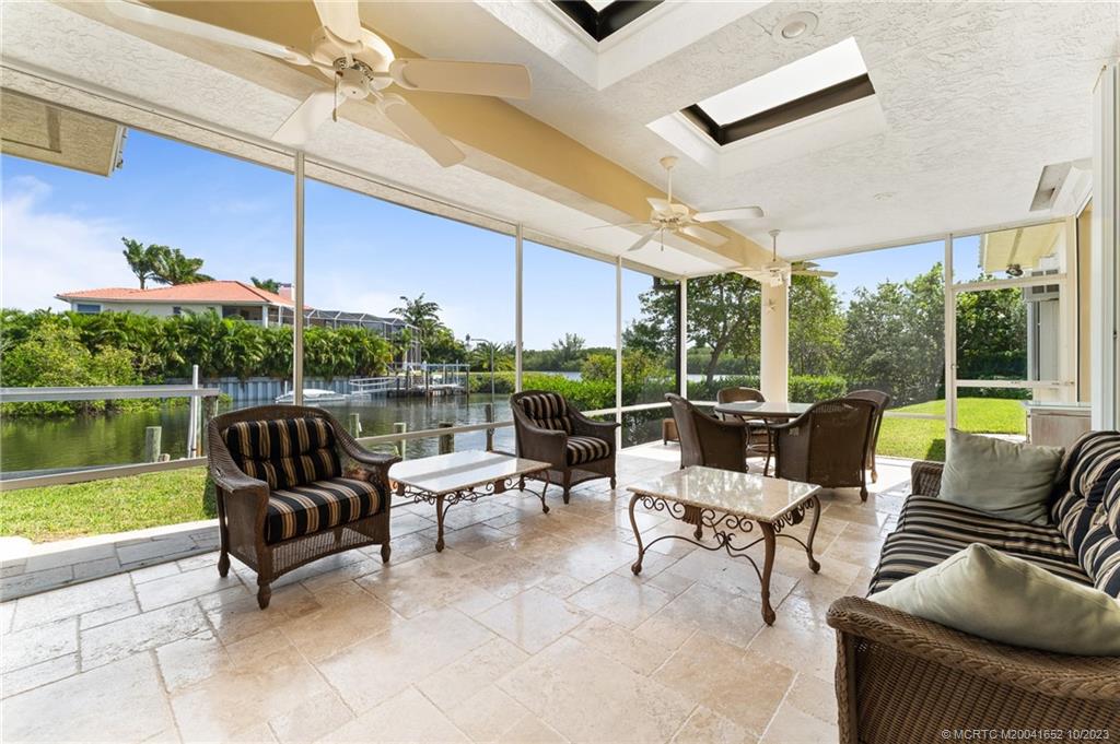 103 Aqua Ra Drive Jensen Beach, FL 34957 - Photo 18 of 48 a building outdoor space with patio furniture and garden