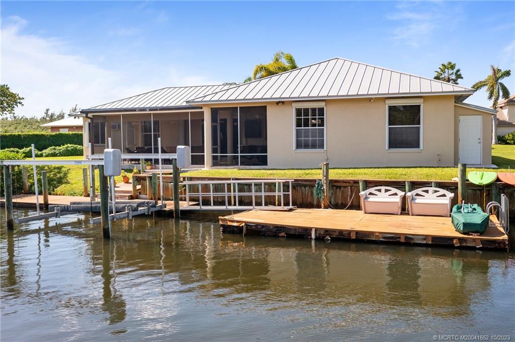 103 Aqua Ra Drive Jensen Beach, FL 34957 - Photo 26 of 48 a view of a house with swimming pool