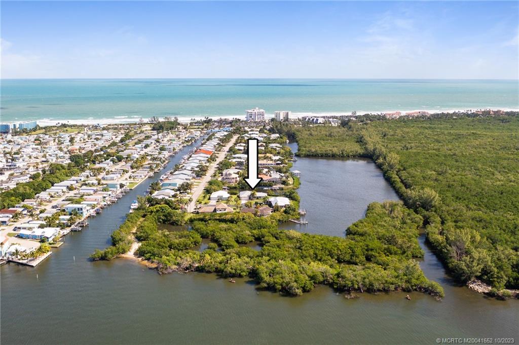 103 Aqua Ra Drive Jensen Beach, FL 34957 - Photo 3 of 48 a view of an ocean and beach