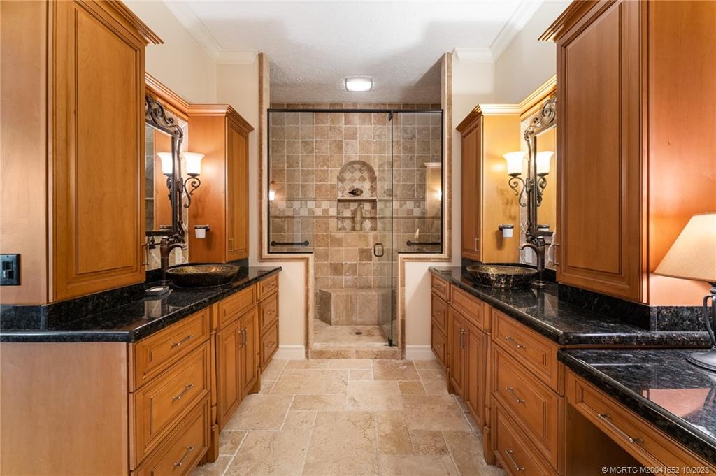 103 Aqua Ra Drive Jensen Beach, FL 34957 - Photo 33 of 48 a large kitchen with granite countertop a sink and a refrigerator