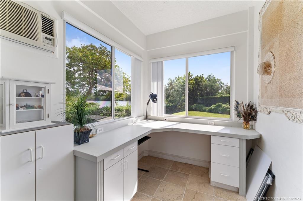103 Aqua Ra Drive Jensen Beach, FL 34957 - Photo 36 of 48 a kitchen with a sink and large window