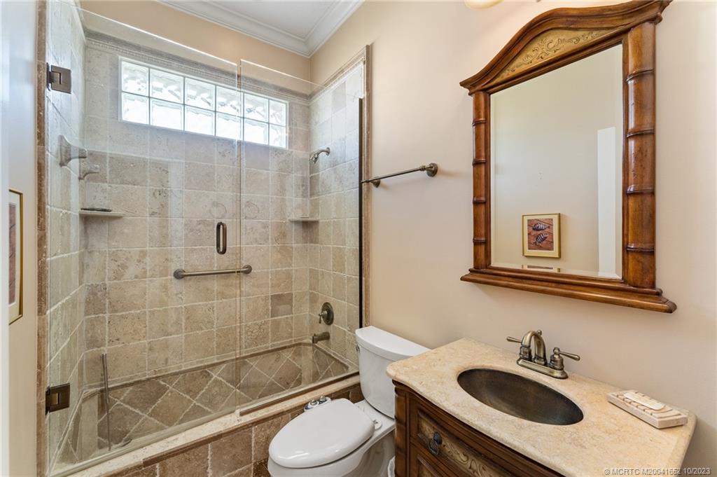 103 Aqua Ra Drive Jensen Beach, FL 34957 - Photo 38 of 48 a bathroom with a sink toilet and shower