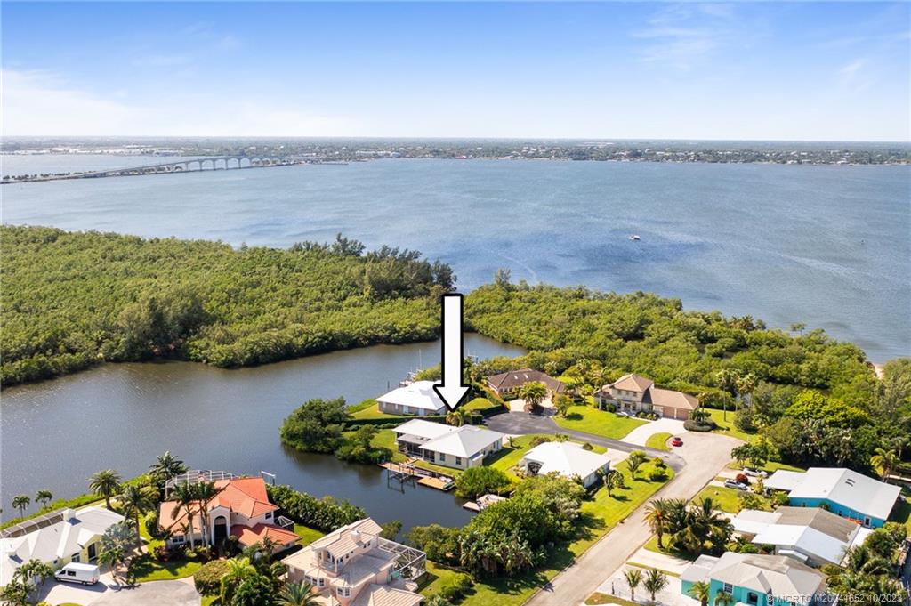 103 Aqua Ra Drive Jensen Beach, FL 34957 - Photo 45 of 48 a view of a lake with a lake
