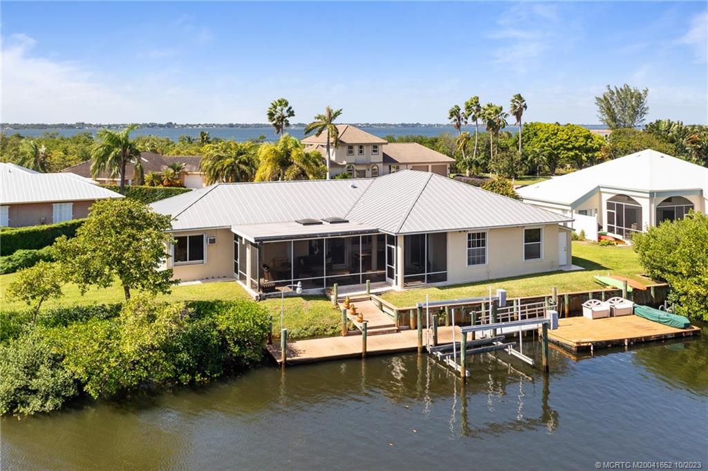 103 Aqua Ra Drive Jensen Beach, FL 34957 - Photo 47 of 48 a front view of a house with a ocean view