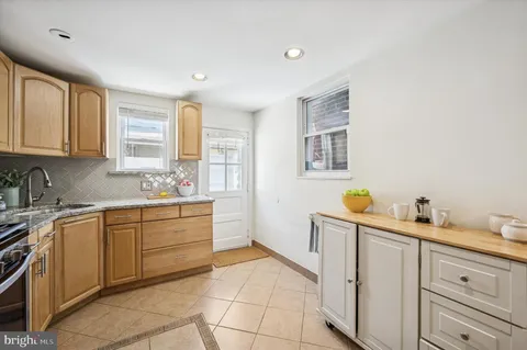 a kitchen with a sink and cabinets