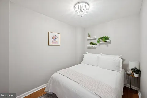 a bedroom with a bed and a table in it