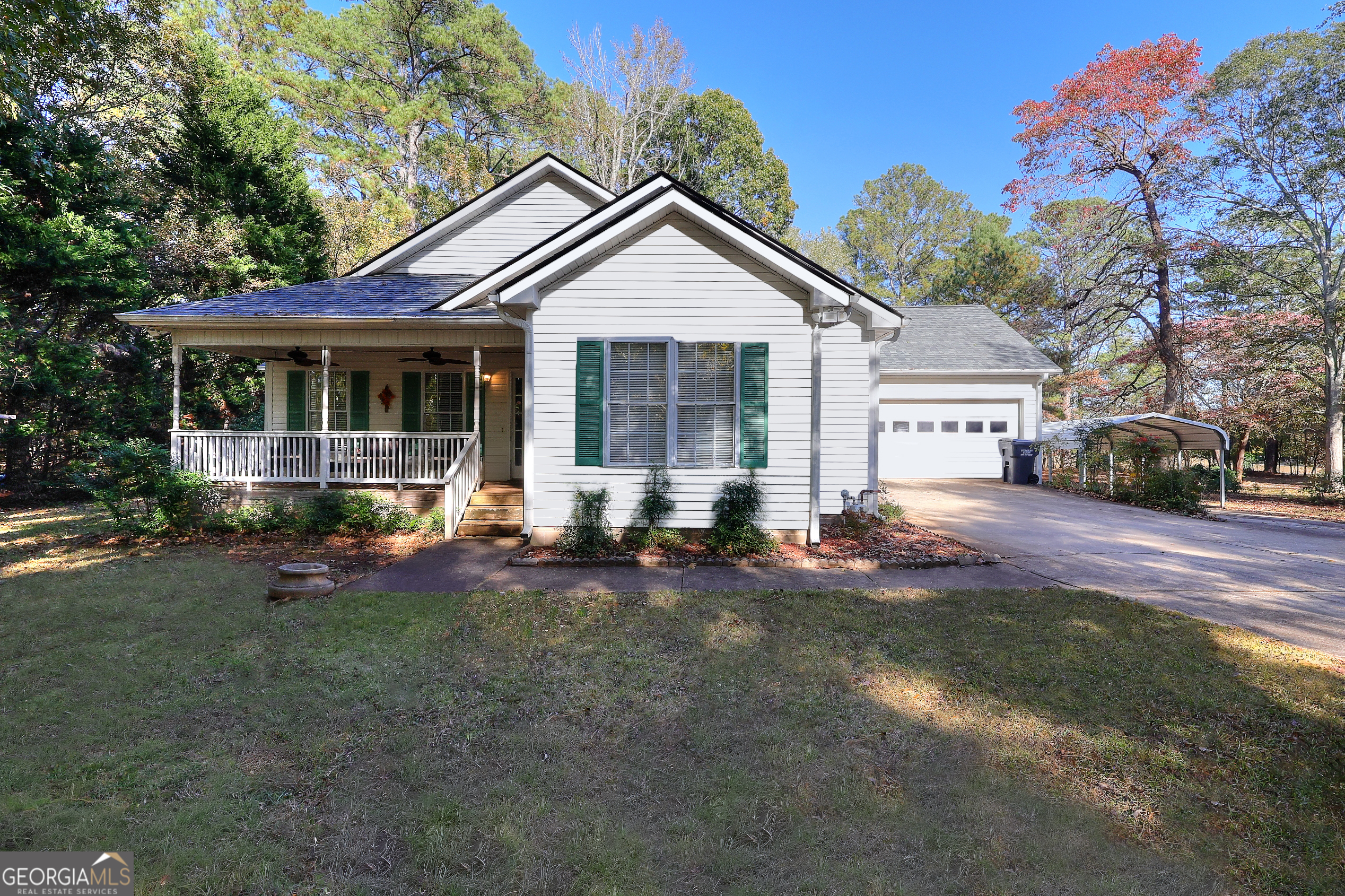 a view of a house with backyard sitting area and garden