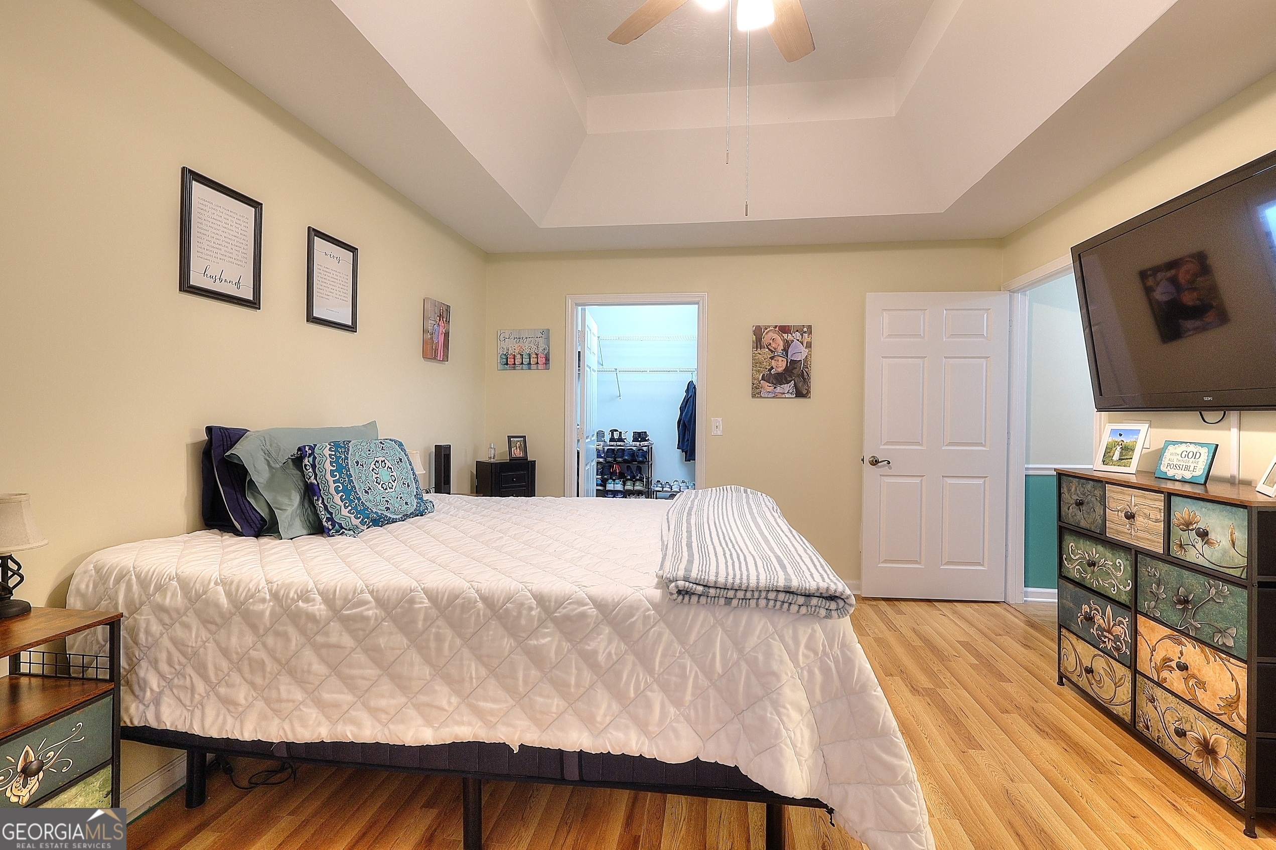 245 Tamea Trail Covington, GA 30014 - Photo 12 of 31 a bedroom with a bed and a flat screen tv