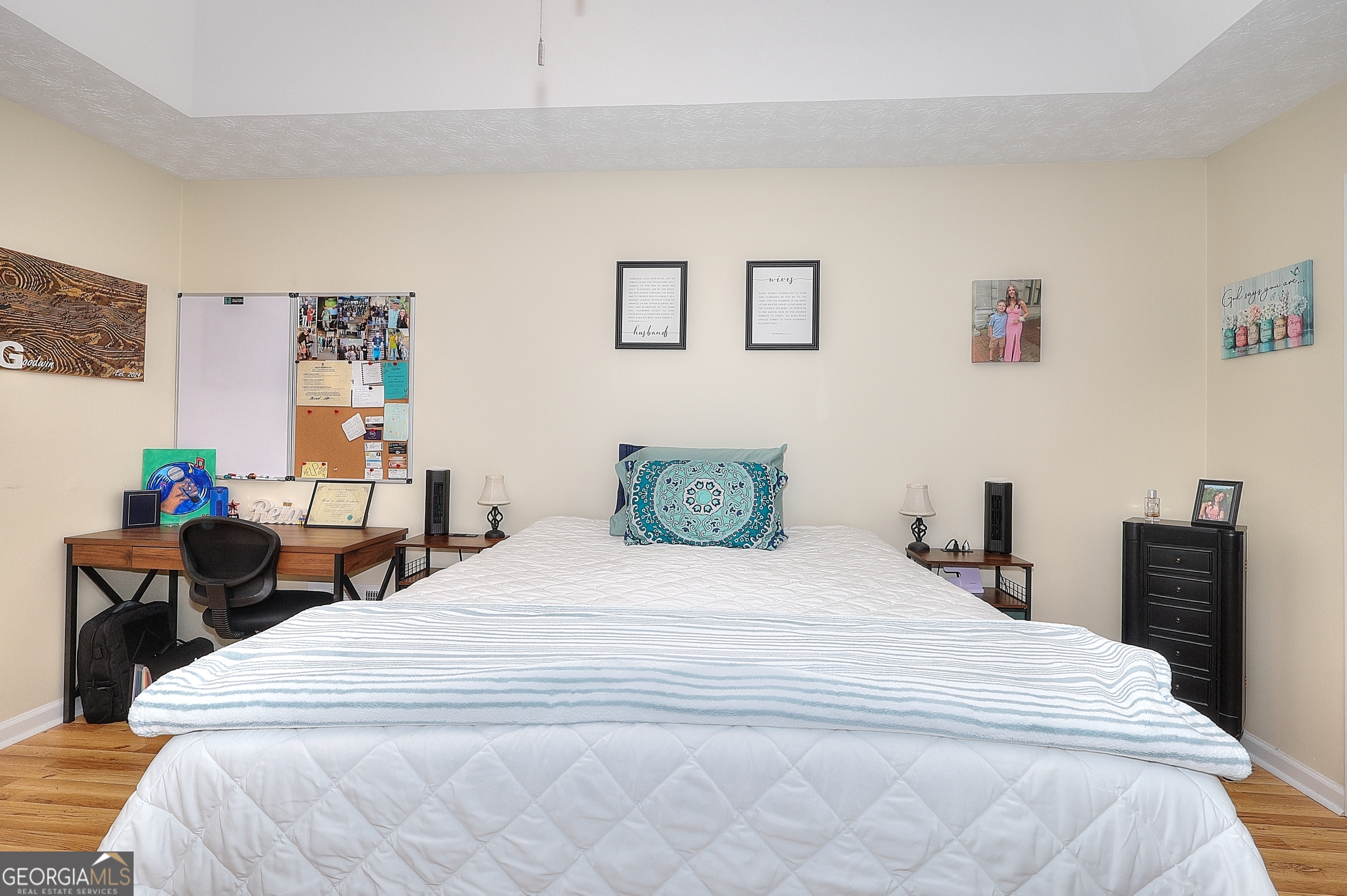 245 Tamea Trail Covington, GA 30014 - Photo 14 of 31 a bedroom with a bed and dresser