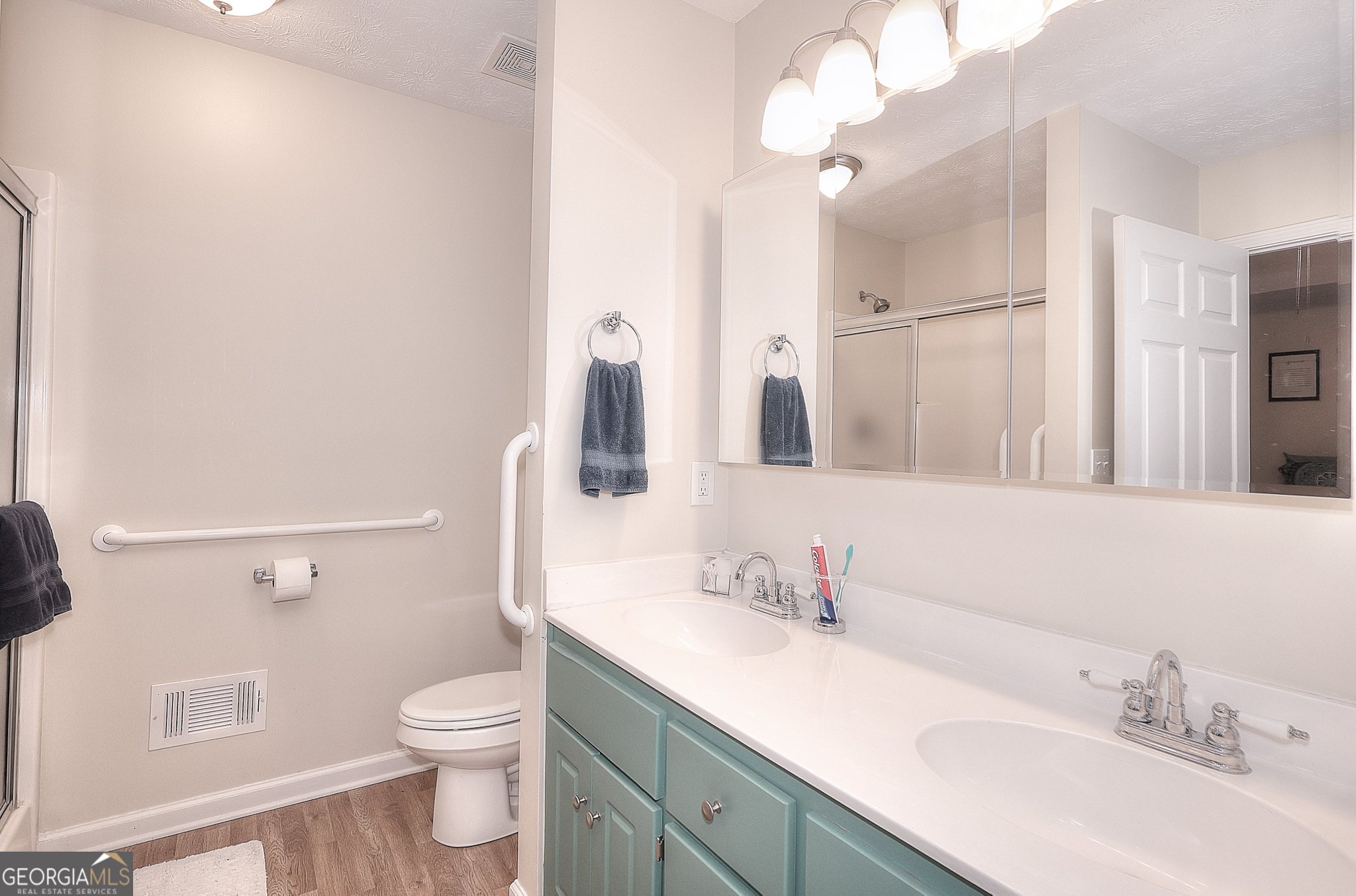245 Tamea Trail Covington, GA 30014 - Photo 17 of 31 a bathroom with a sink vanity granite and toilet
