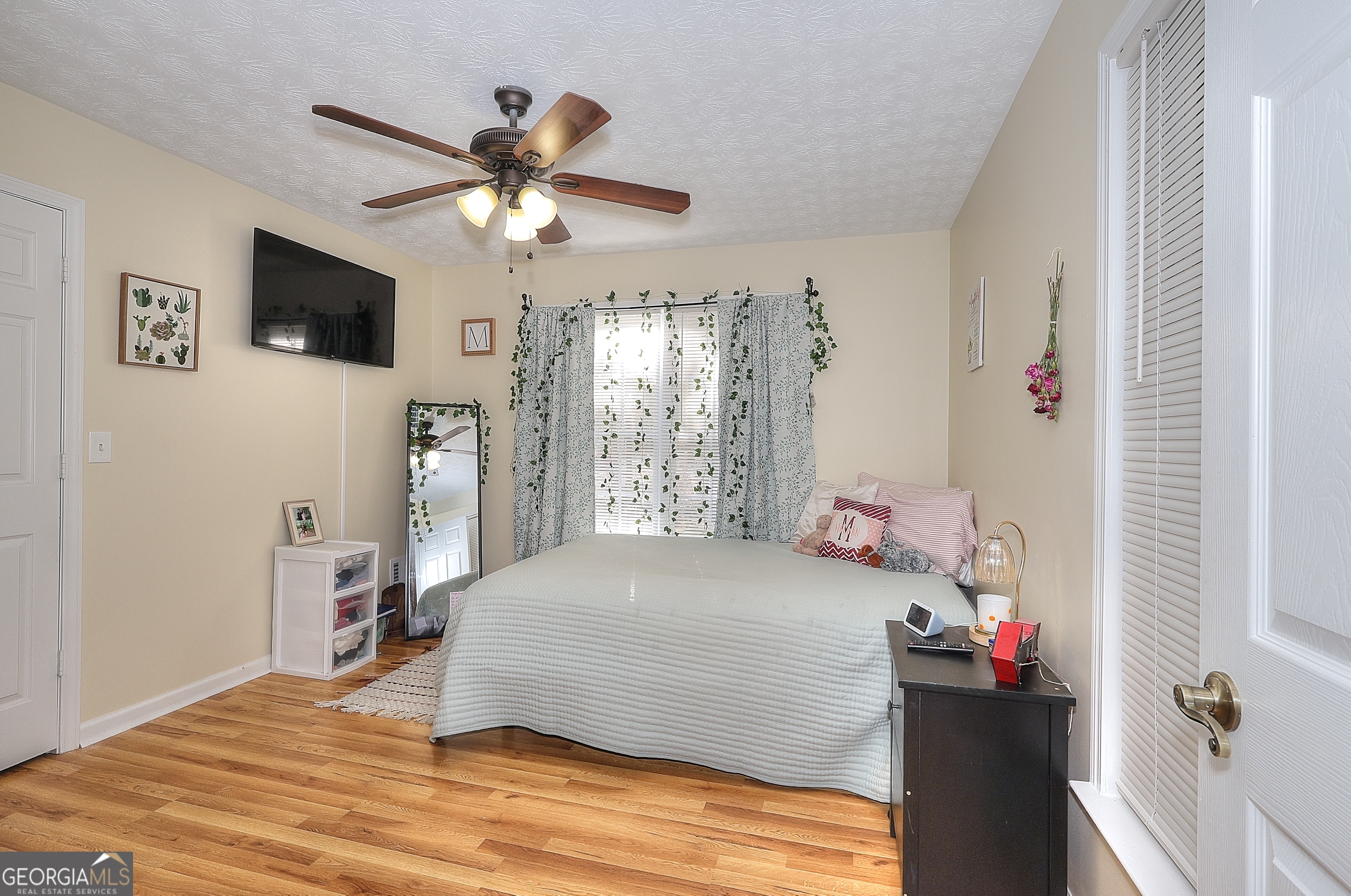 245 Tamea Trail Covington, GA 30014 - Photo 19 of 31 a bedroom with a bed and a window