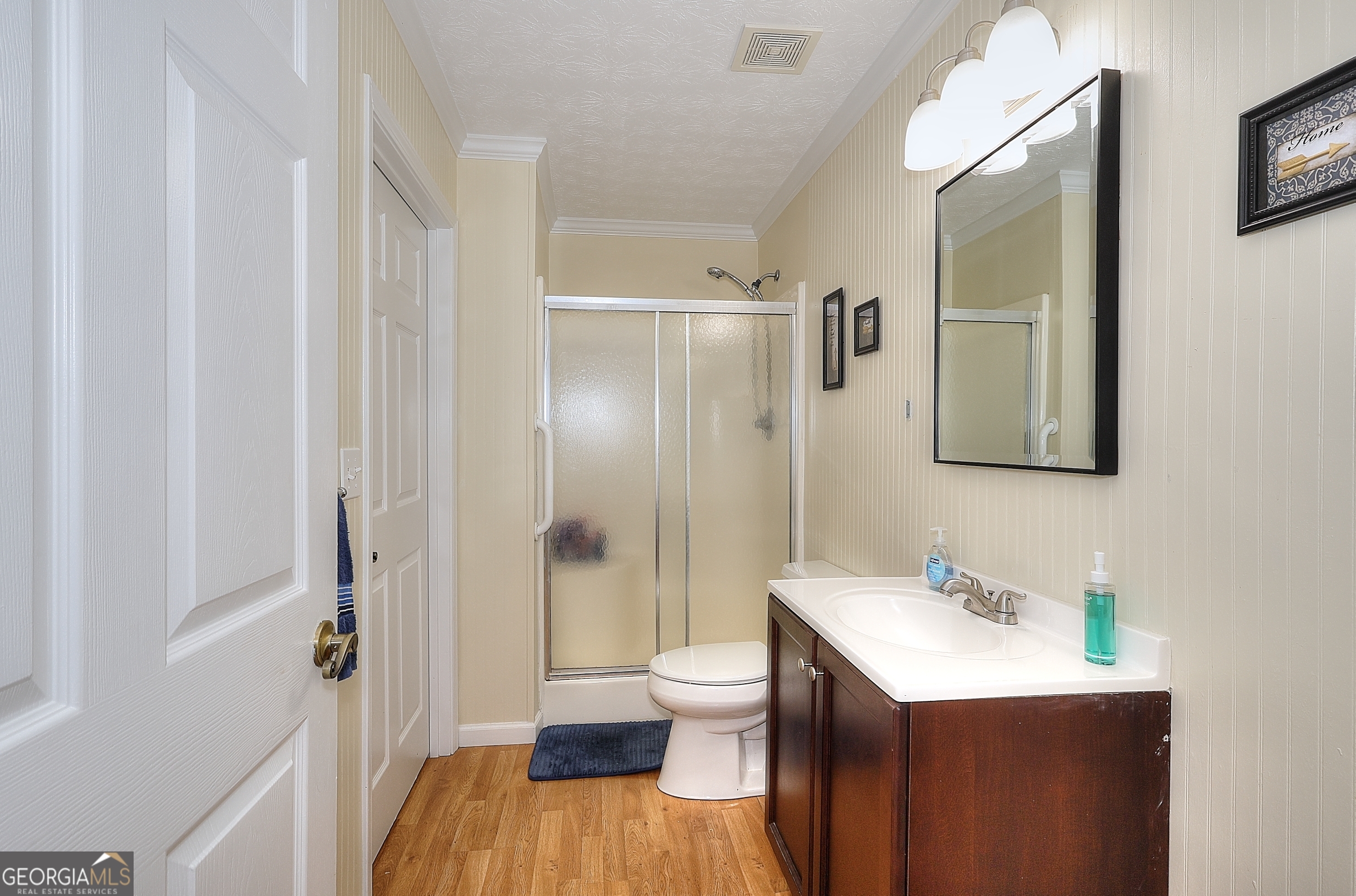 245 Tamea Trail Covington, GA 30014 - Photo 21 of 31 a bathroom with a sink a toilet and shower