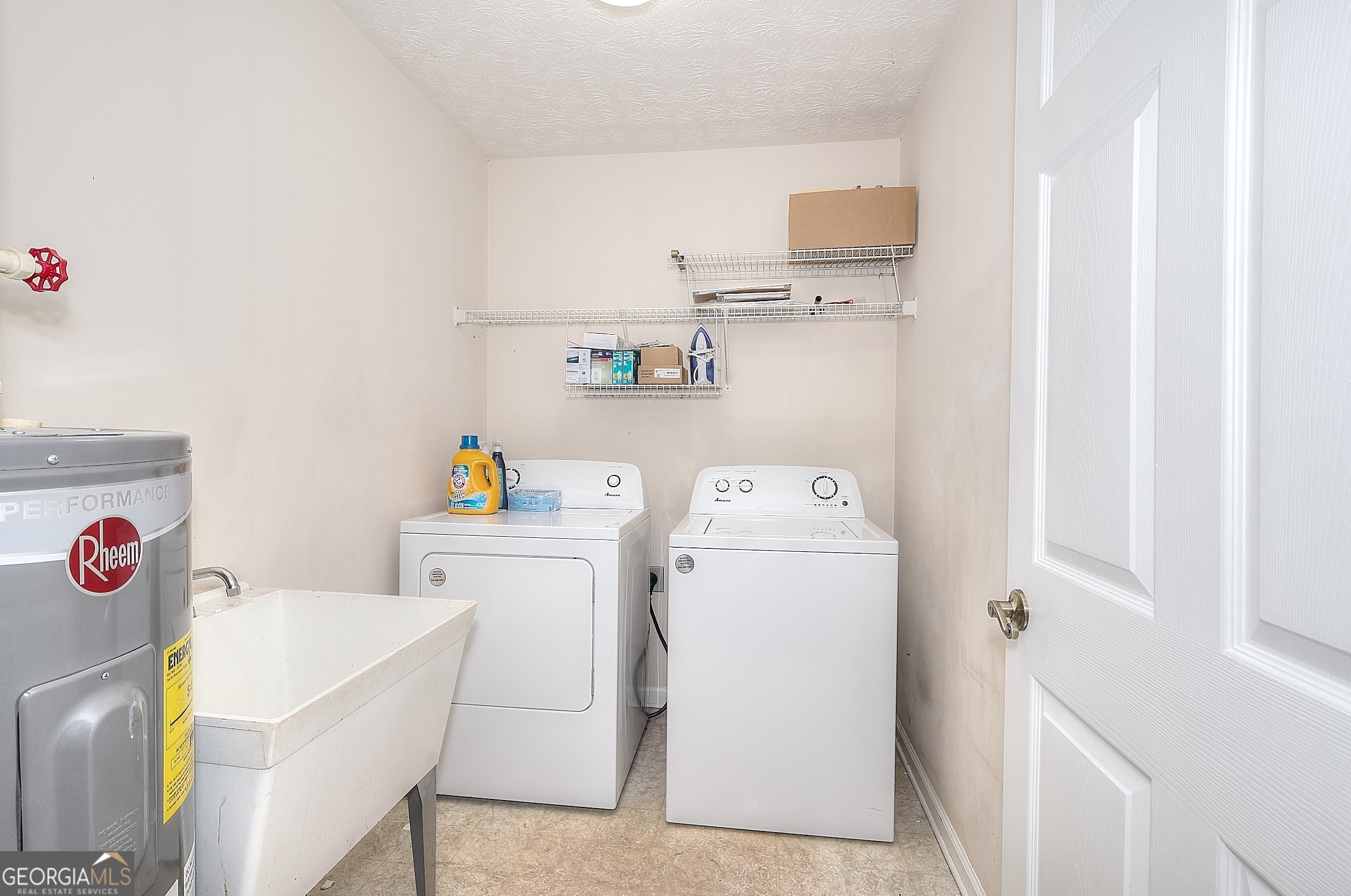 245 Tamea Trail Covington, GA 30014 - Photo 24 of 31 a utility room with dryer and washer