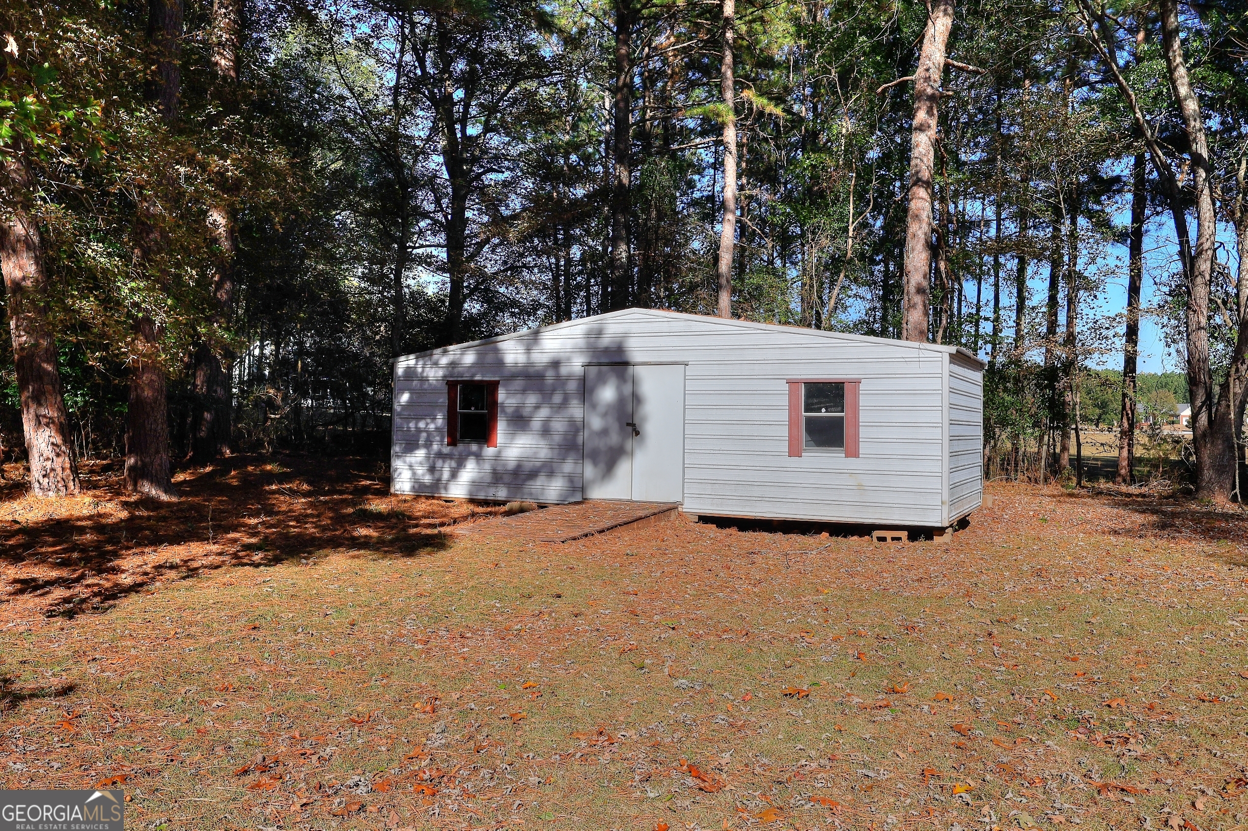 245 Tamea Trail Covington, GA 30014 - Photo 28 of 31 a view of a house with a snow in the yard