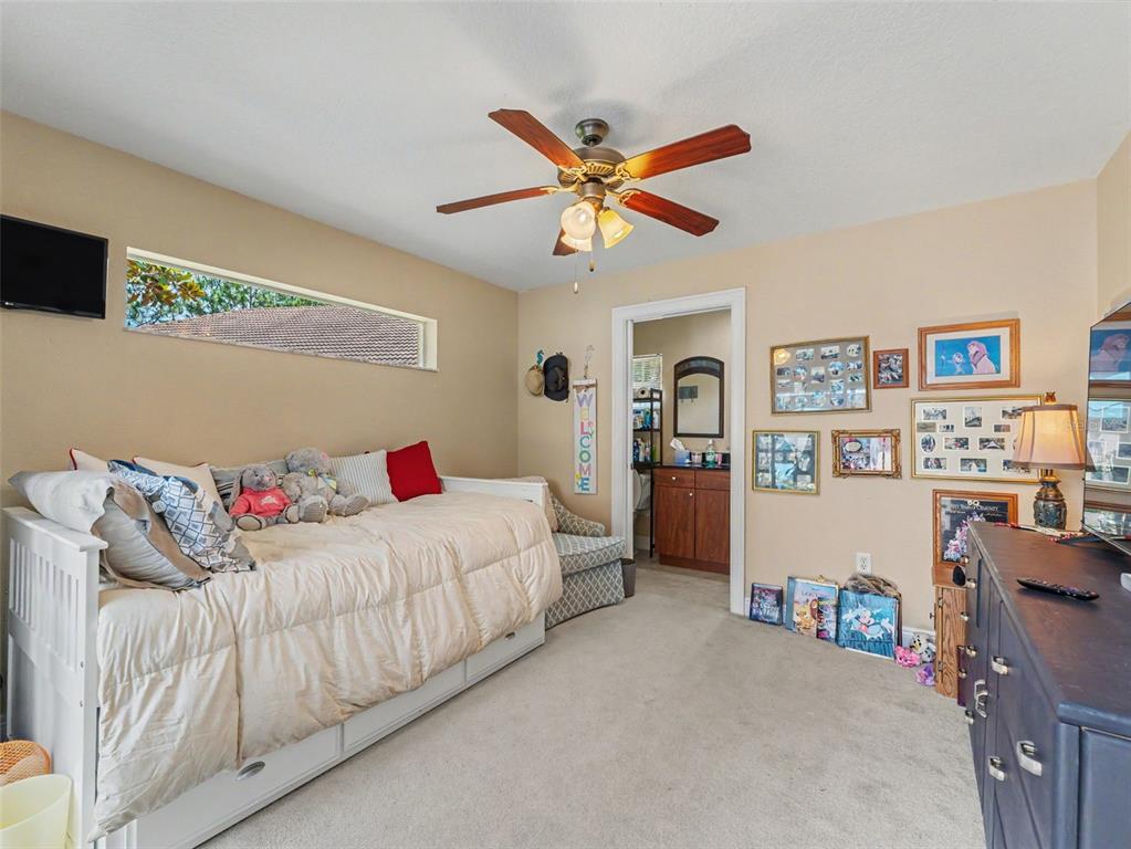 8910 Jericho Road Weeki Wachee, FL 34613 - Photo 9 of 52 a bedroom with a bed and cabinets