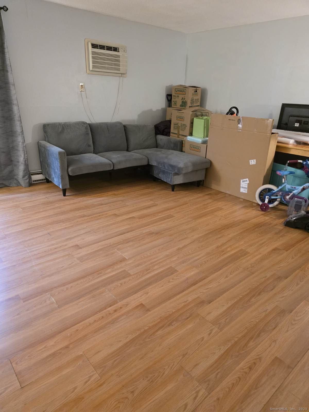 20 Lakeside Drive, Unit P Ledyard, CT 06339 - Photo 15 of 19 a living room with furniture and a wooden floor