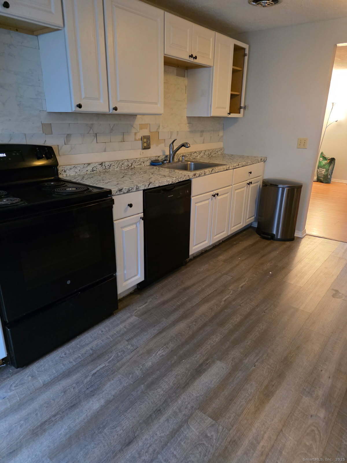 20 Lakeside Drive, Unit P Ledyard, CT 06339 - Photo 19 of 19 a kitchen with a sink a stove and cabinets