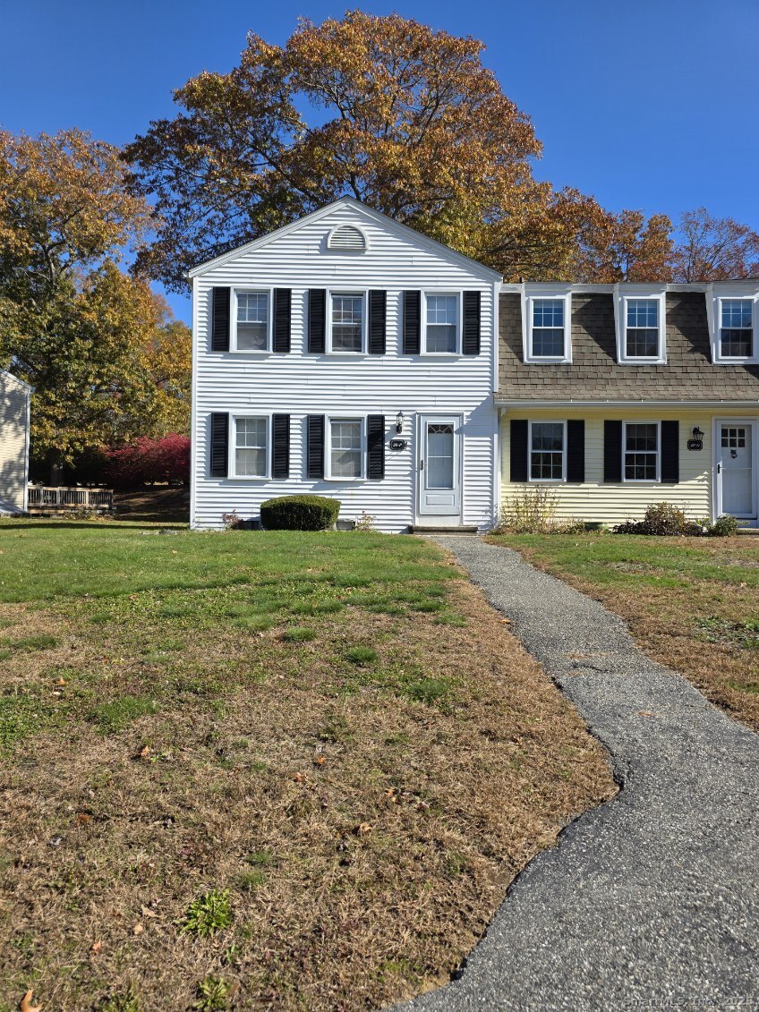 20 Lakeside Drive, Unit P Ledyard, CT 06339 - Photo 2 of 19 a front view of a house with a garden