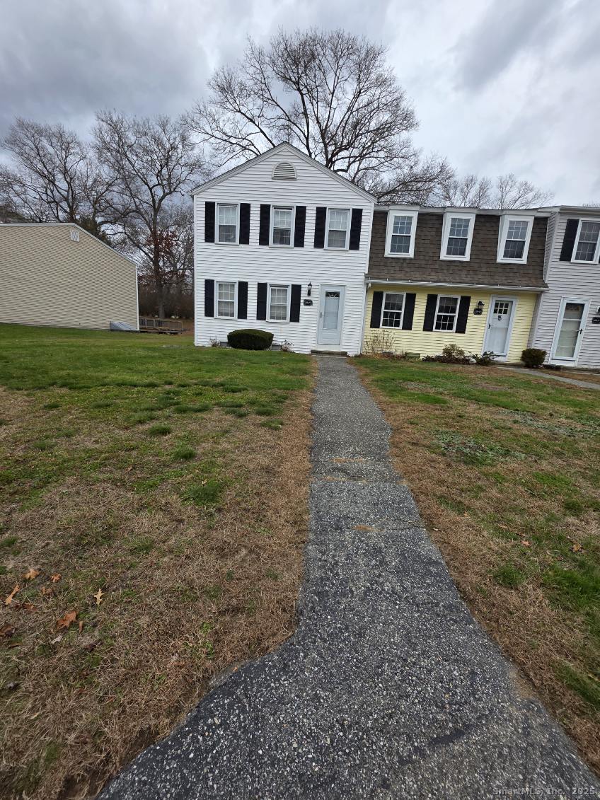 20 Lakeside Drive, Unit P Ledyard, CT 06339 - Photo 3 of 19 a front view of a house with a yard