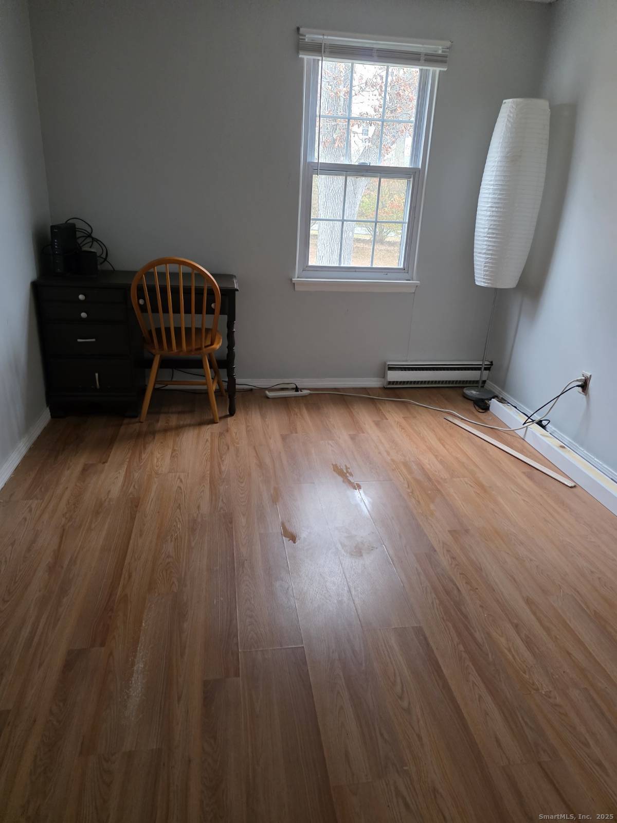 20 Lakeside Drive, Unit P Ledyard, CT 06339 - Photo 6 of 19 a room with wooden floor and windows
