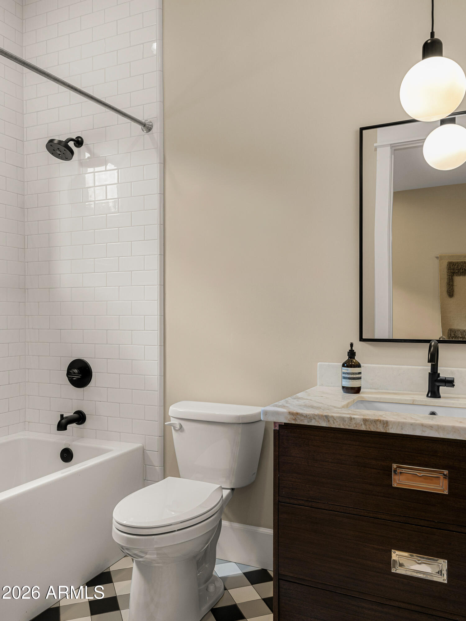 4204 North 57th Way Phoenix, AZ 85018 - Photo 29 of 34 a bathroom with a sink a toilet a mirror and shower