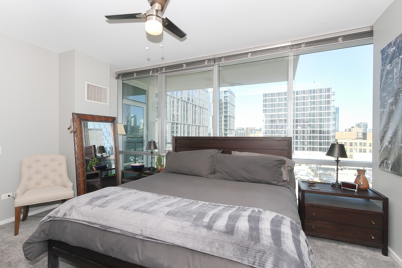 123 South Green Street, Unit 801B Chicago, IL 60607 - Photo 11 of 20 a bedroom with a large bed and a window