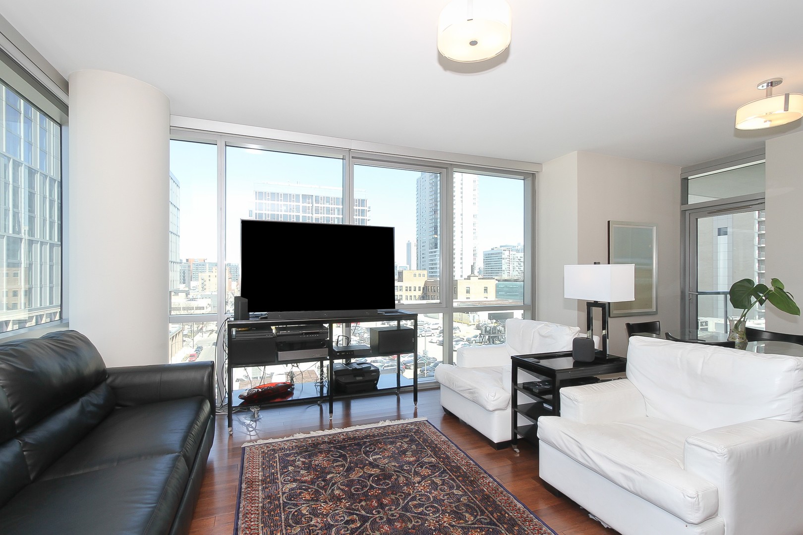 123 South Green Street, Unit 801B Chicago, IL 60607 - Photo 3 of 20 a living room with furniture and a flat screen tv