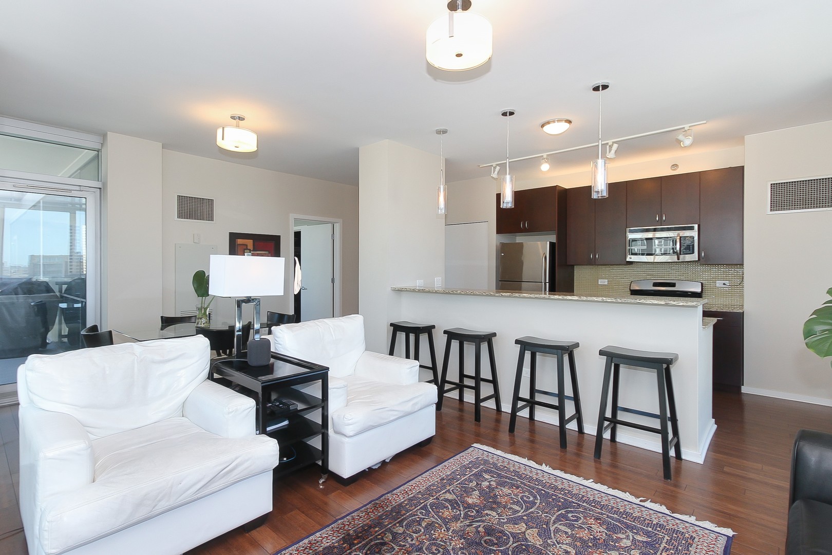 123 South Green Street, Unit 801B Chicago, IL 60607 - Photo 5 of 20 a living room with furniture and a wooden floor