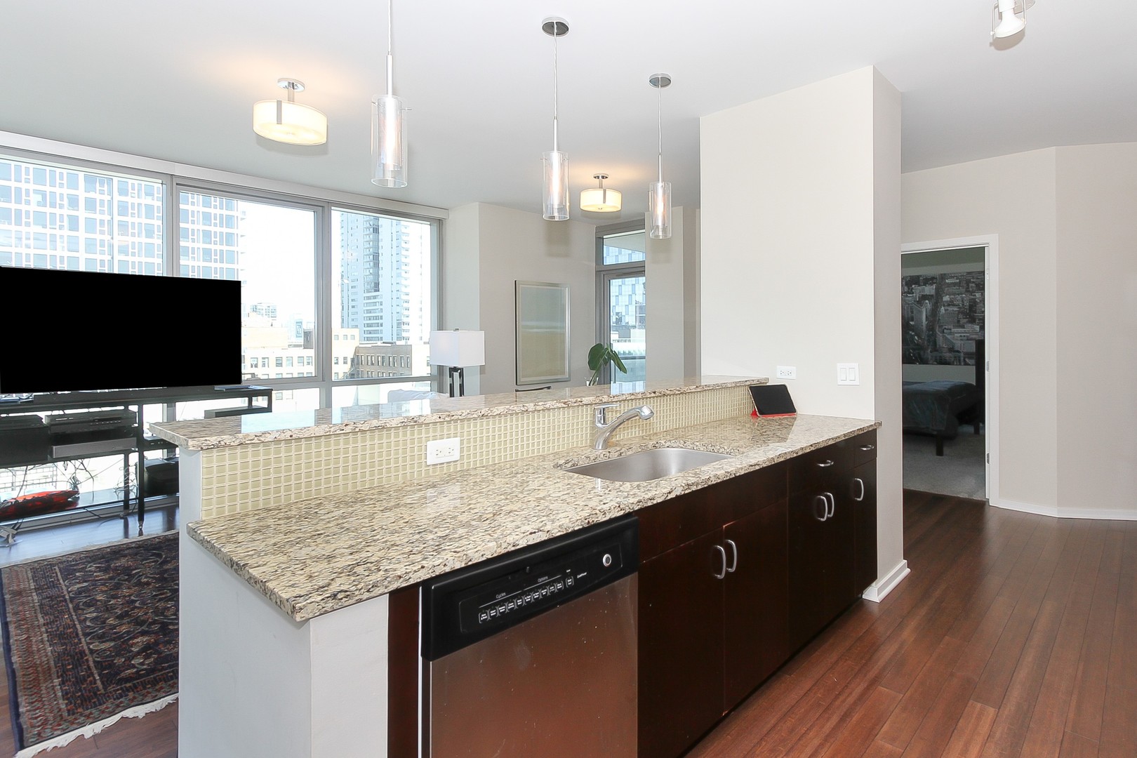 123 South Green Street, Unit 801B Chicago, IL 60607 - Photo 8 of 20 a bathroom with a granite countertop sink and a mirror