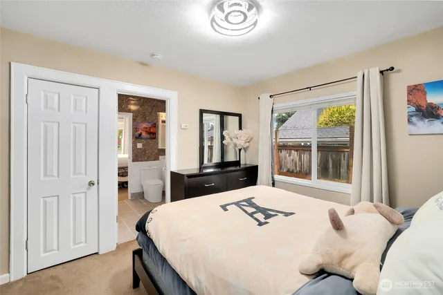 a bedroom with a bed and a dresser