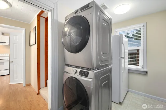 a view of a hallway with washer and dryer