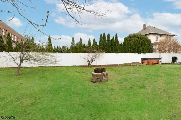 a view of yard with swimming pool and green space