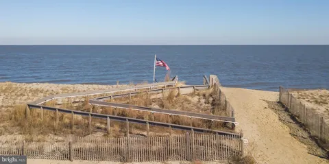 a front view of a building with retail shops