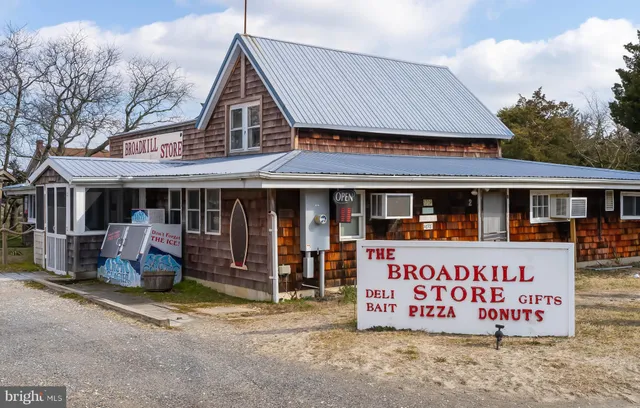 a kitchen with stainless steel appliances granite countertop a stove and cabinets