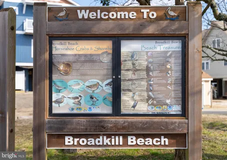a view of a brick building with large windows
