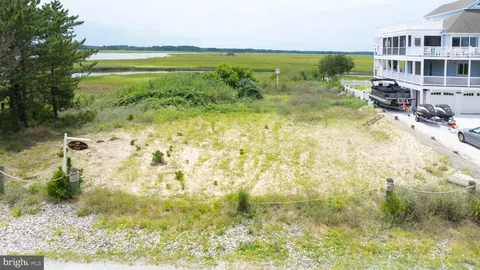 a view of a lake with a building in the background