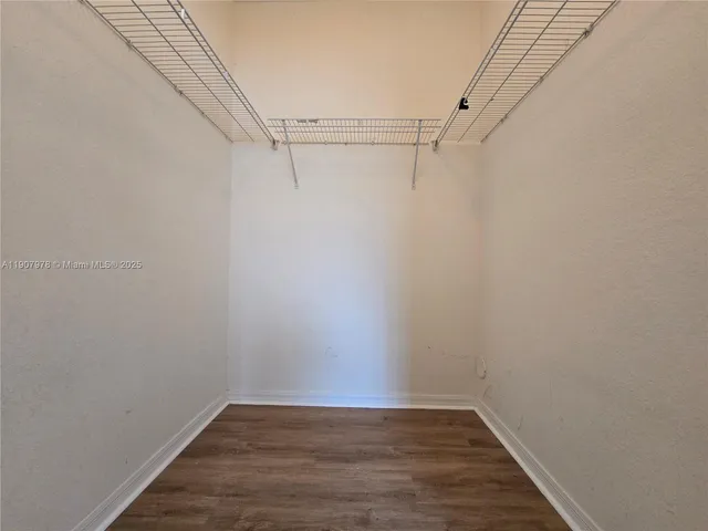 a view of an empty walk in closet