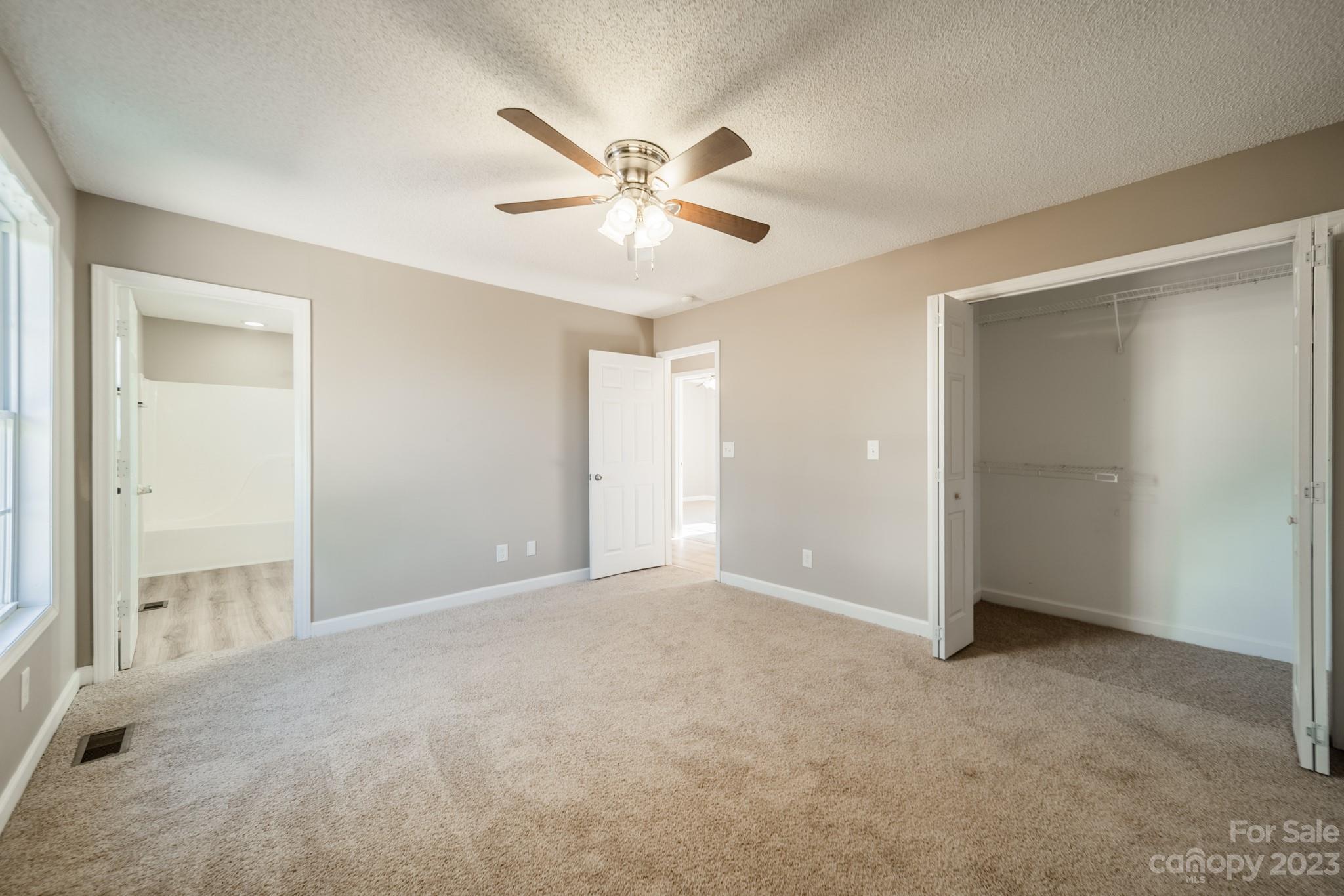 300 Walkers Ridge Drive Shelby, NC 28152 - Photo 11 of 15 a view of an empty room with a ceiling fan
