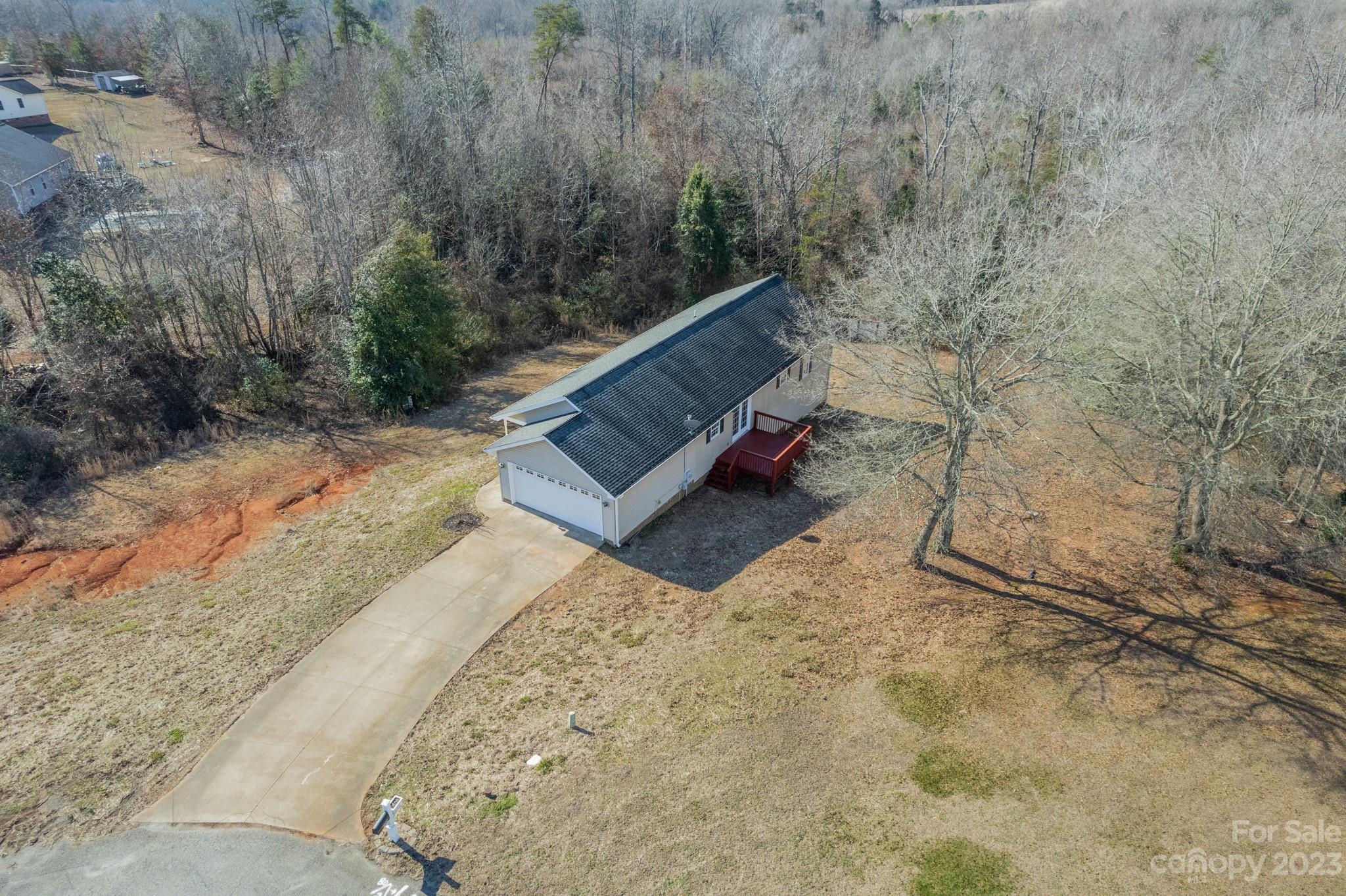 300 Walkers Ridge Drive Shelby, NC 28152 - Photo 15 of 15 a view of a backyard with wooden fence