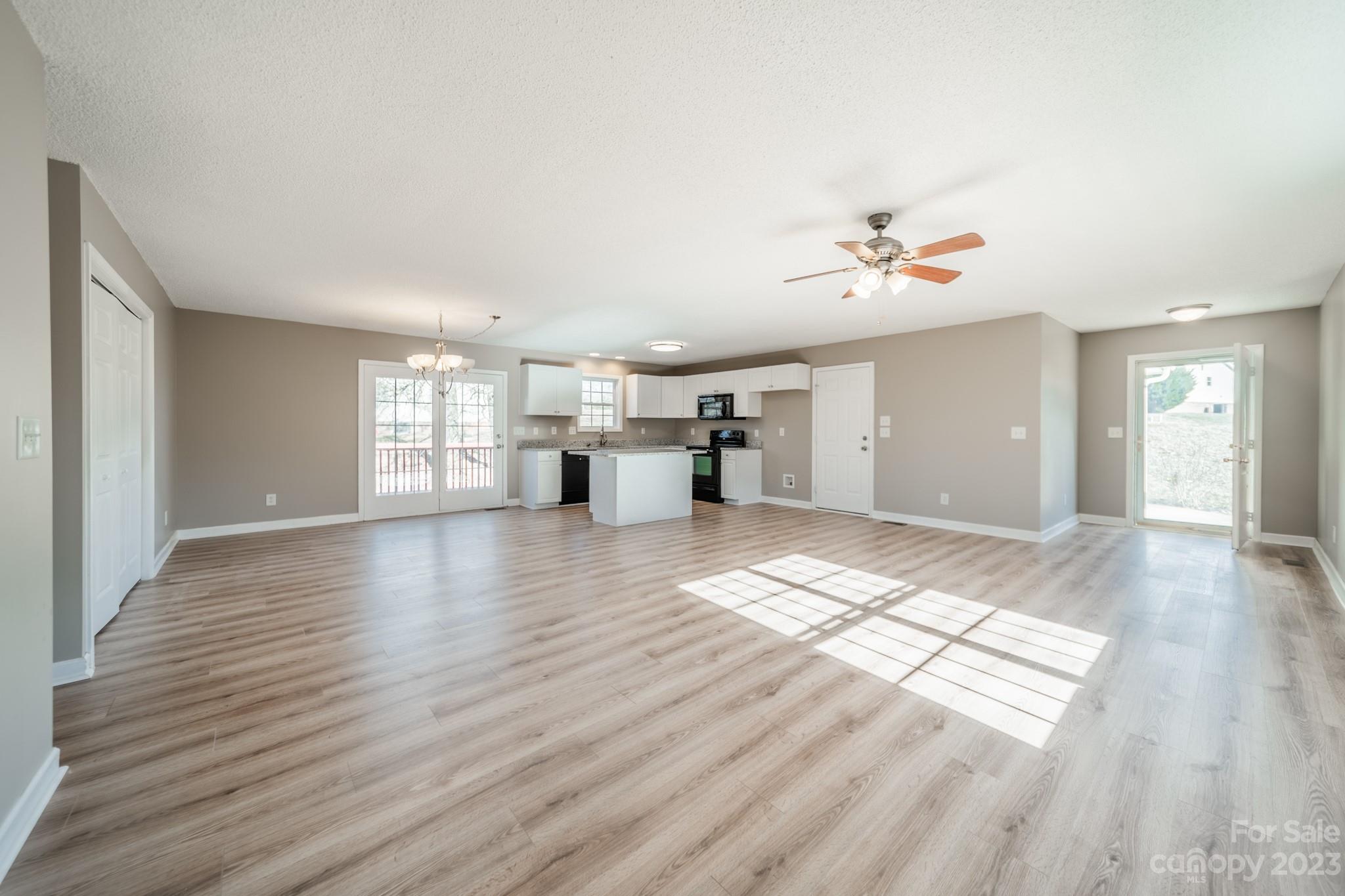300 Walkers Ridge Drive Shelby, NC 28152 - Photo 4 of 15 a view of empty room with wooden floor and fan