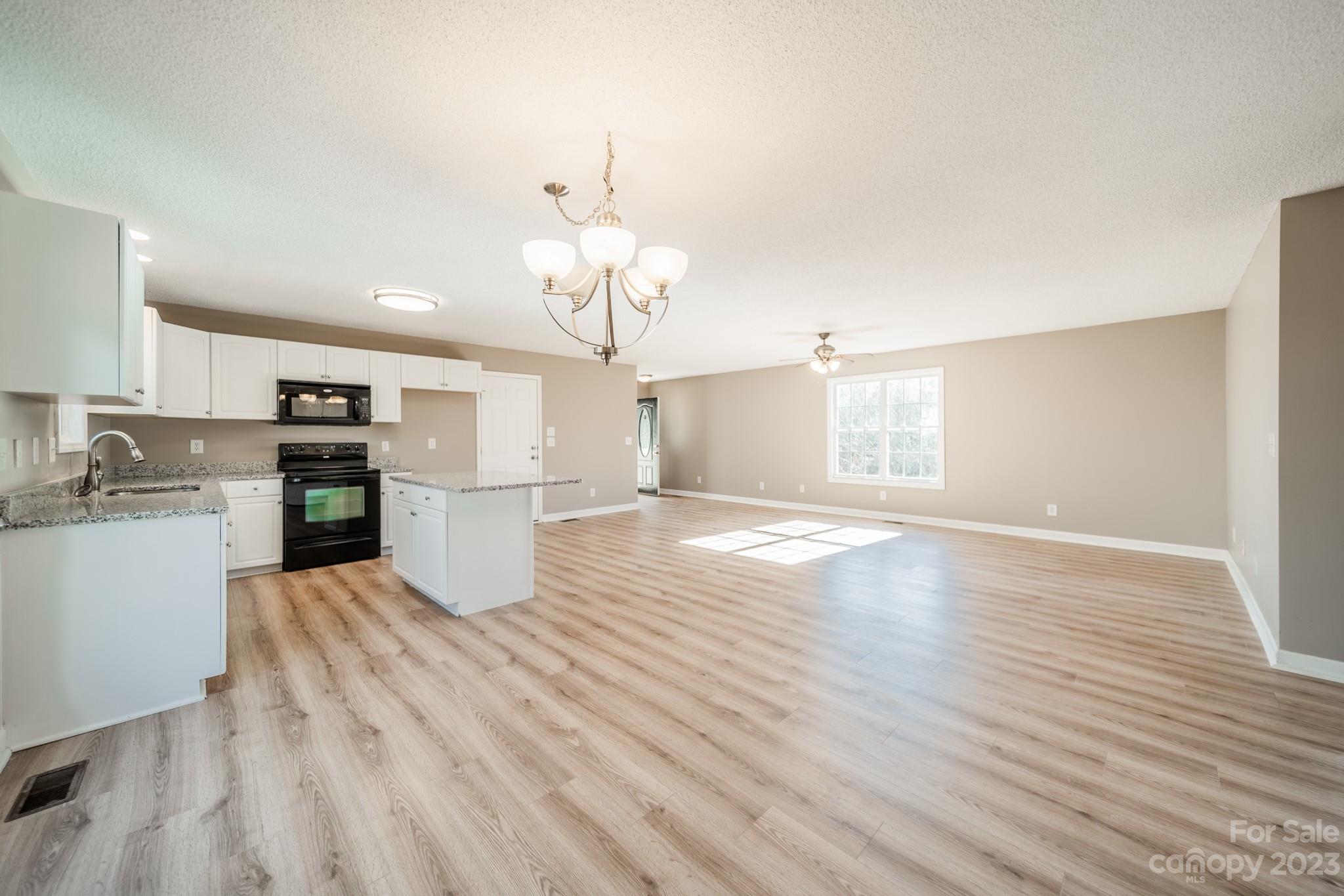 300 Walkers Ridge Drive Shelby, NC 28152 - Photo 5 of 15 a view of kitchen with granite countertop cabinets and refrigerator