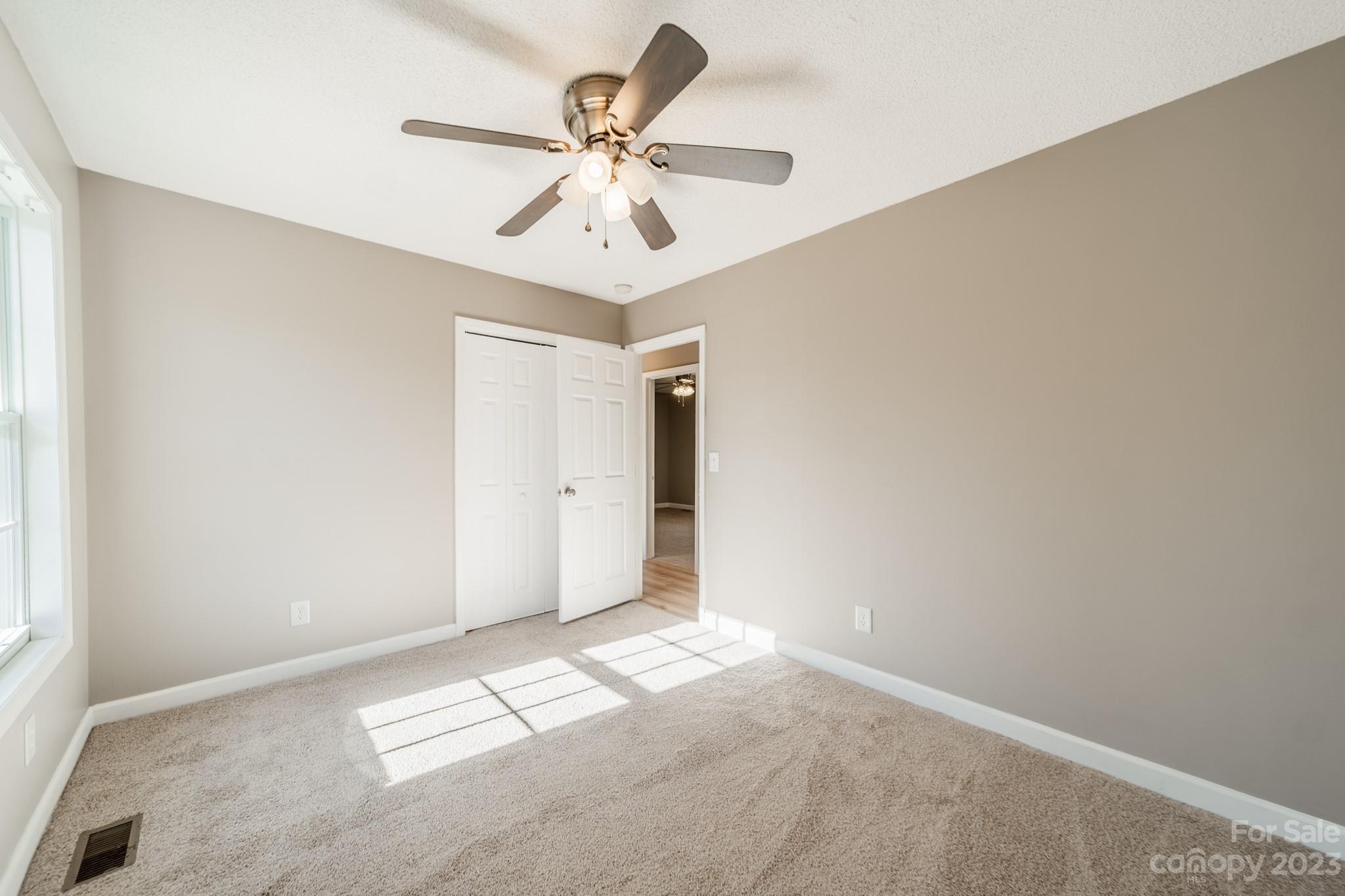 300 Walkers Ridge Drive Shelby, NC 28152 - Photo 7 of 15 a view of a big room with wooden floor and chandelier fan