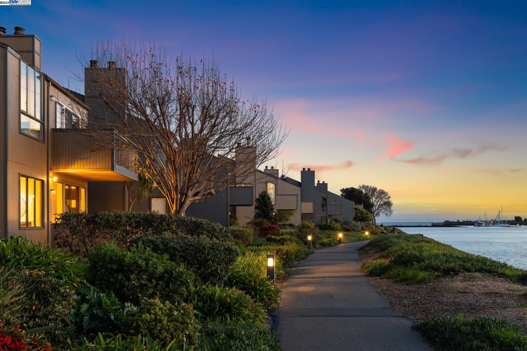 a pathway of a house with a yard