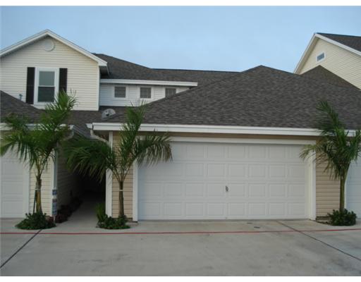 15209 South Padre Island Drive, Unit 104 Corpus Christi, TX 78418 - Photo 1 of 6 a front view of house with small garden