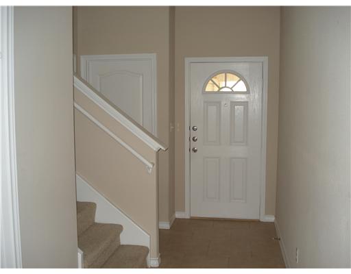 15209 South Padre Island Drive, Unit 104 Corpus Christi, TX 78418 - Photo 3 of 6 a view of a hallway with windows and stairs