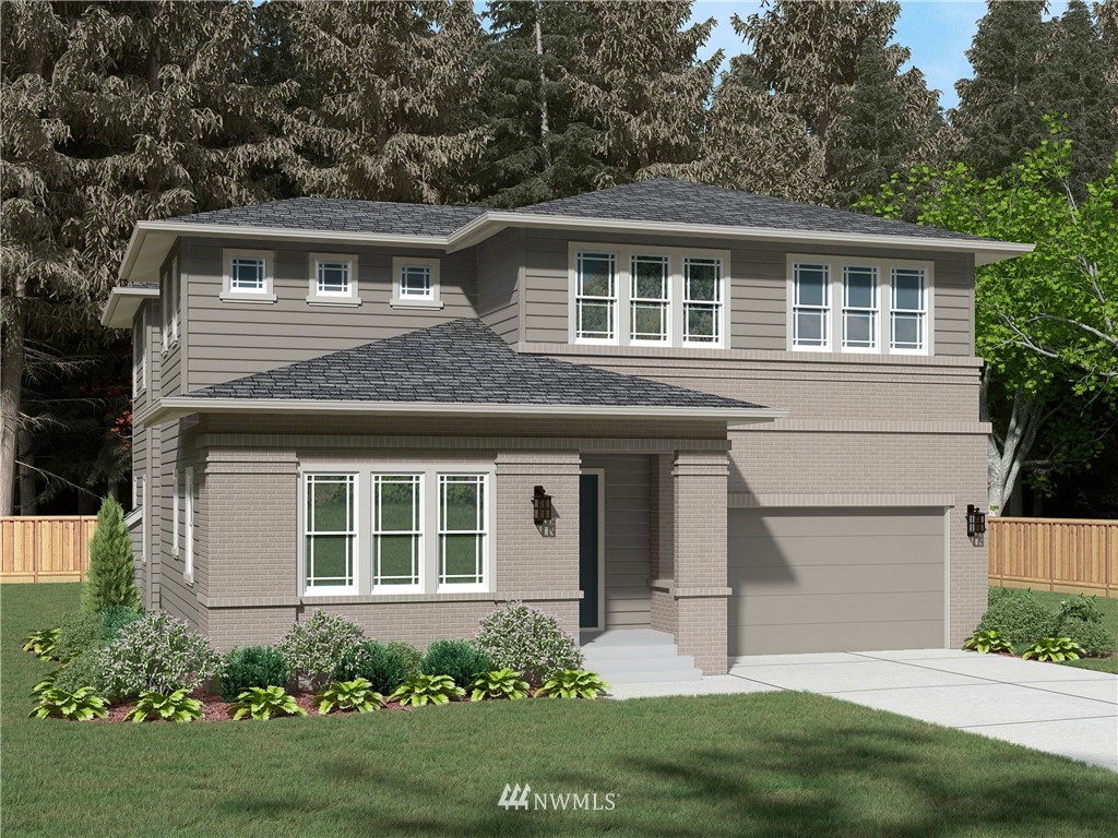 21634 35th Avenue Southeast, Unit 20 Bothell, WA 98021 - Photo 1 of 14 a front view of a house with a yard and garage