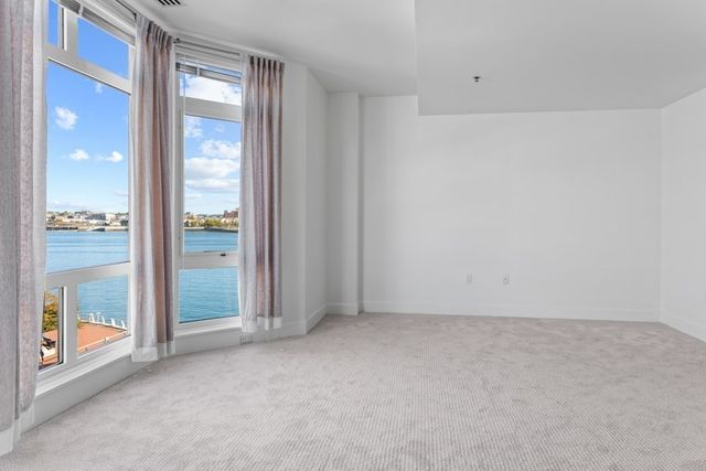 an empty room with glass door